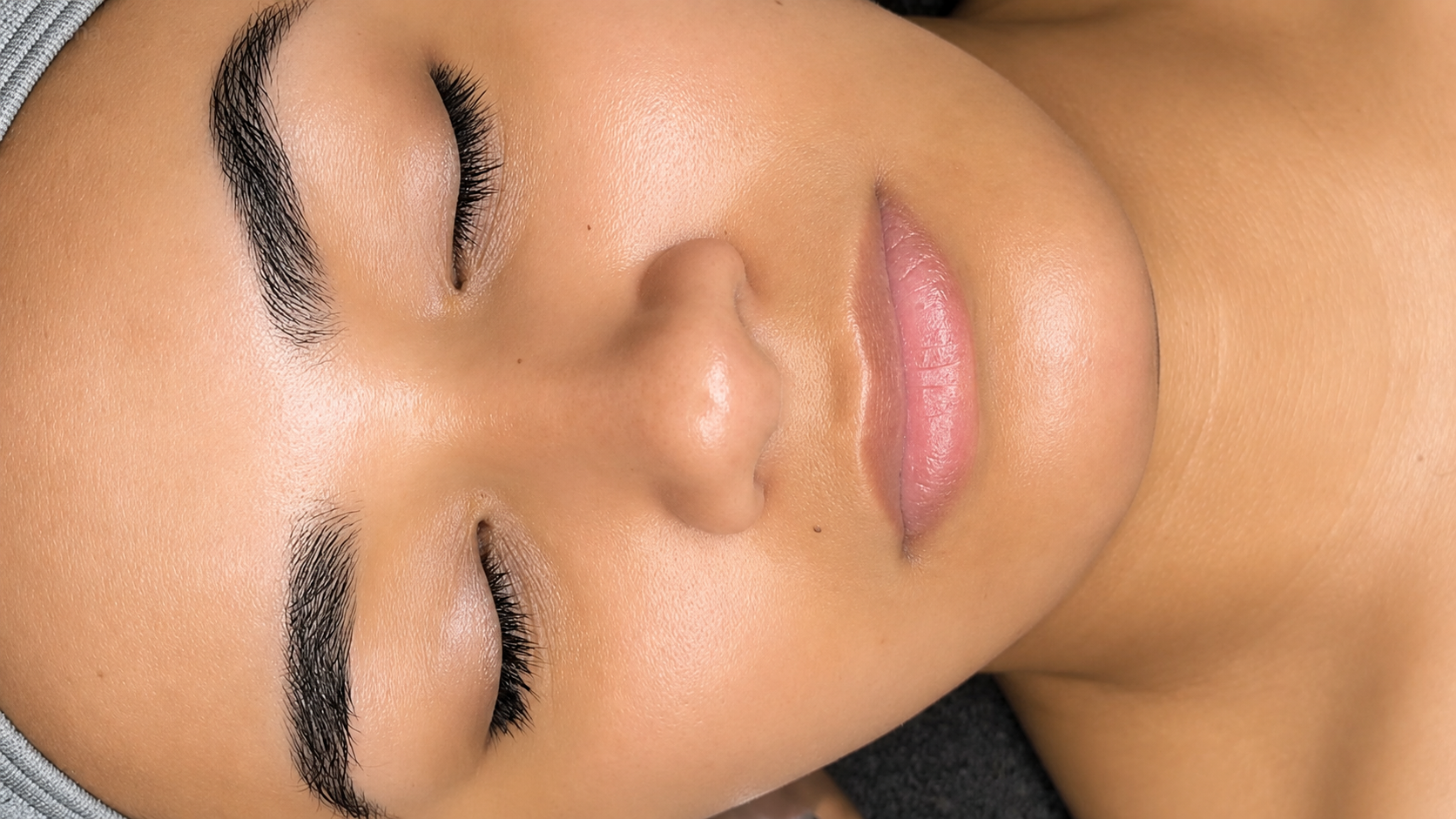 Close-up of a client with glowing skin during a facial