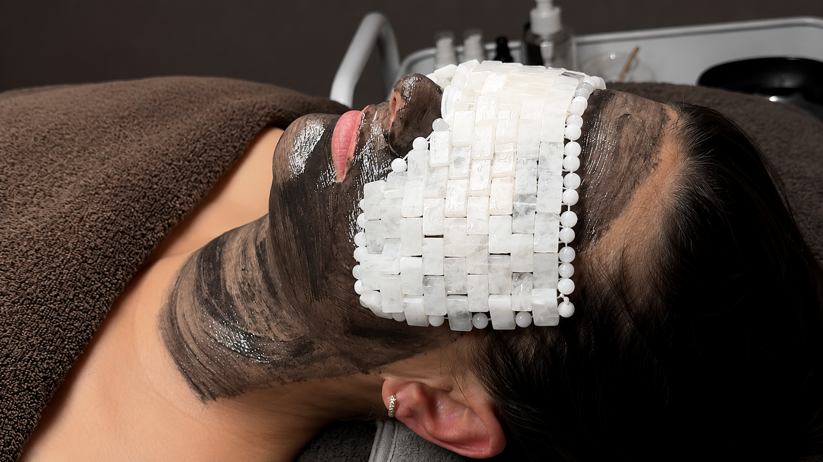 Cooling gel mask applied during a facial treatment