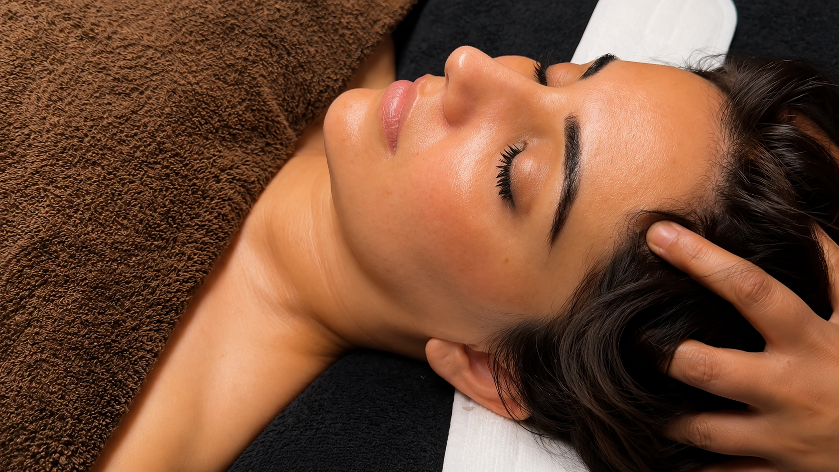 Soothing scalp and temple massage during a treatment